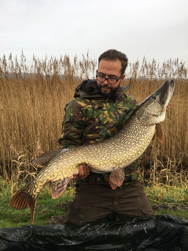 Geert Ooms Big Pike Fishing wearing Fortis SJ9 Jacket to keep warm in winter
